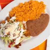Flautas · 3 Crispy tacos with lettuce, pico de gallo, cheese & cream on the top side of Rice & Beans.
...