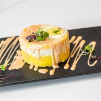Causa · Whipped potatoes seasoned with lime and yellow peppers.