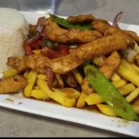 Pollo Saltado · Sautéed chicken with onions, tomatoes, red peppers, and green onions. Served with white rice...