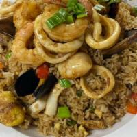 Arroz Chaufa De Mariscos · Peruvian fried rice mixed with seafood and seasoned with sesame oil, ginger, spring onion, r...