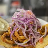 Chicharron · Served with fried yuca and salsa criolla.