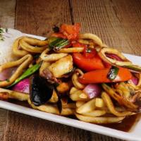 Saltado De Mariscos · Variety of seafood sautéed with onions and tomatoes.