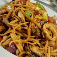 Tallarin Saltado Mariscos · Peruvian stir fried noodles with seafood, onions, tomatoes, red peppers, green onions, soy s...