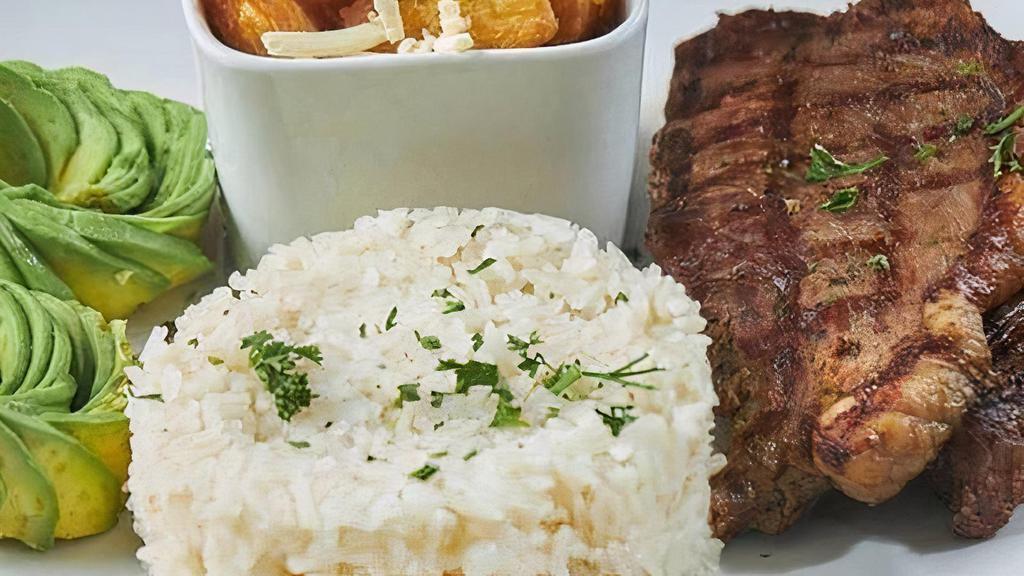 Picanha Churrasco · Served with fried yuca, avocado and white rice.