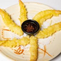 Tempura · Two pieces of shrimp tempura and six pieces of vegetable deep fried tempura served with temp...