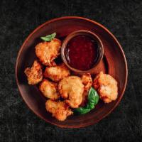 Wok Tossed Garlic Cauliflowerettes · Fresh cauliflower crisps, wok tossed in a tangy sauce with ginger, garlic, jalapeno and blac...
