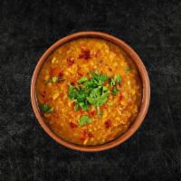 Tomato Daal Yellow Mellow  · Yellow lentils, slow-cooked to perfection and tempered with tomatoes, cumin, garlic, and chi...