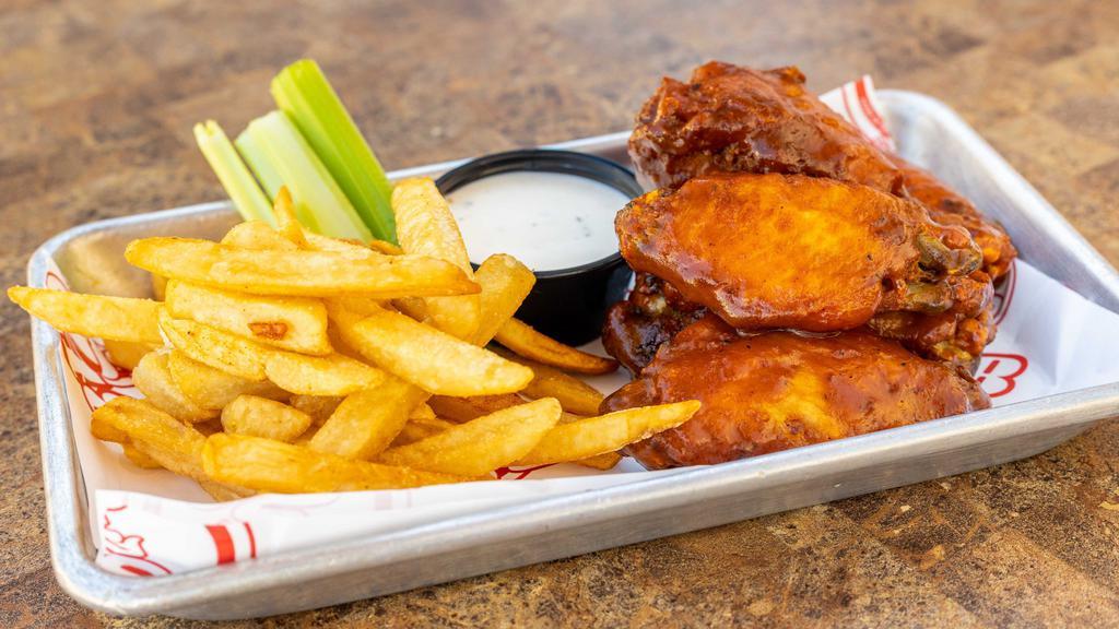 Gourmet Chicken Wings (50) · Gourmet wings with fries.