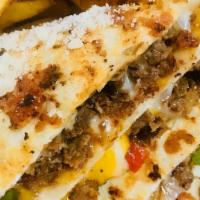 Quesadilla (Steak) · Flaky tortilla filled with seasoned, mushrooms, red and green peppers, onions, and mozzarell...