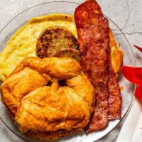 Turkey Bacon Breakfast Sandwich · 2 crispy strips of turkey bacon, scrambled eggs and cheese on your choice of croissant or bi...
