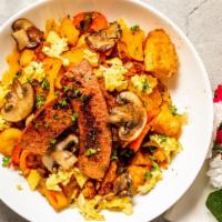 Hash Bowl · Turkey Polish Sausage, eggs, breakfast potatoes, onions, tri peppers, and mushrooms topped w...