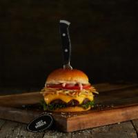 Frita Burger · Black Angus ground beef burger on a brioche bun topped with cheddar, lettuce, tomatoes, whit...