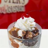 Peanut Butter Cup Sundae · 2 scoops of your favorite ice cream topped with Reese's chunks, warm, yummy peanut butter, f...