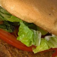Spicy Jack · A spicy Jackfruit patty topped with pickels, lettuce, tomato.