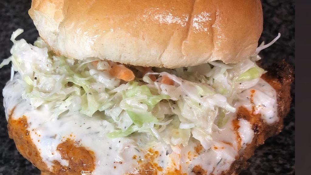 Buffalo Jack · A spicy Jackfruit patty tossed in a signature Buffalo sauce, homemade vegan ranch and crunchy homemade slaw.