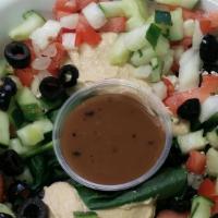 Greek Salad · Hummus, feta cheese, black olives, onion, tomato, cucumber, spinach, balsamic vinaigrette.
