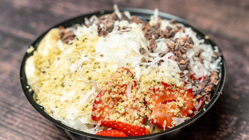 Chocolate Acai Bowl · Almond milk blended with acai, banana, cacao powder, and almond butter topped with strawberry, hemp seeds, raw almonds, and shredded coconut.