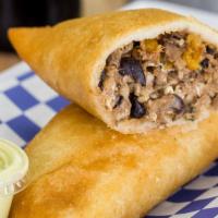 Pabellon Venezuelan Empanada  · Black beans, shredded meat, plantain & cheese