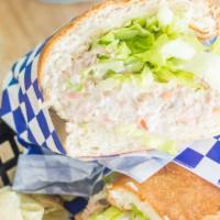 Tuna Deli Sandwich · With tomato, onions, lettuce, and mayonnaise.