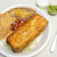#11 Chimichanga Combo · Filled with meat, beans, and cheese. With pico de gallo, sour cream, and guacamole. Served w...