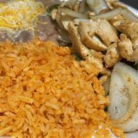 Chicken Fajitas · Served with rice, beans, lettuce, pico de gallo, guacamole, sour cream, and three corn torti...
