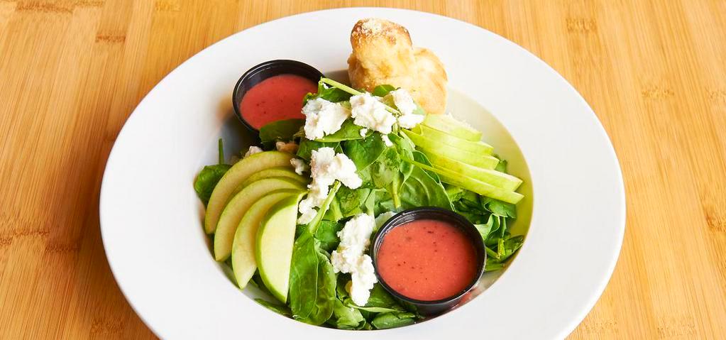 Spinach · Fresh spinach, goat cheese, granny smith apples and strawberry vinaigrette.