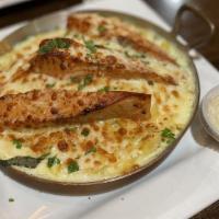 Salmon Thermidor · made with with sauce white wine. butter and a topping or parmesan and mozzarella cheese.