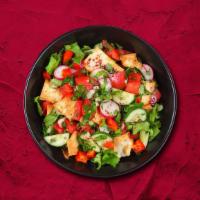 Fattoush Favorite Salad  (Small) · Freshly cut Romaine tomatoes, cucumbers, radish onions, and mint tossed with pita chips in a...