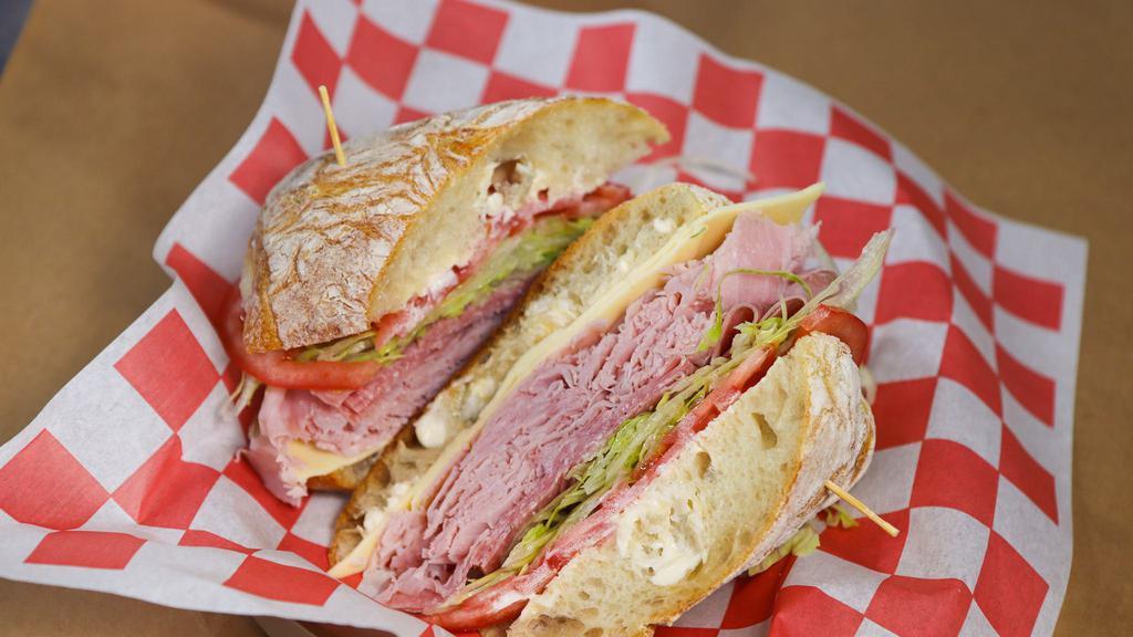 The Frankie (Small) · ham, salami, white American cheese, lettuce, tomato, mayo, spicy mustard, salt, pepper, extra virgin olive oil, and red wine vinegar.