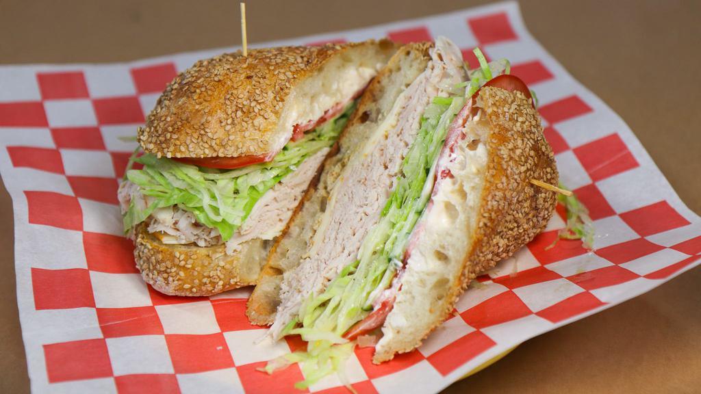 The Wally (Small) · golden roasted turkey, muenster cheese, lettuce, tomato, cucumber, mayo, spicy mustard, salt, pepper, extra virgin olive oil, and red wine vinegar.