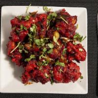Gobi Manchurian · Battered cauliflower, cubed paneer tossed with manchurian sauce. Food Allergy Warning: Food ...