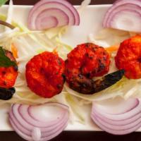 Tandoori Shrimp · Marinated shrimp in spices and yogurt grilled in a tandoor. Food Allergy Warning: Food Prepa...