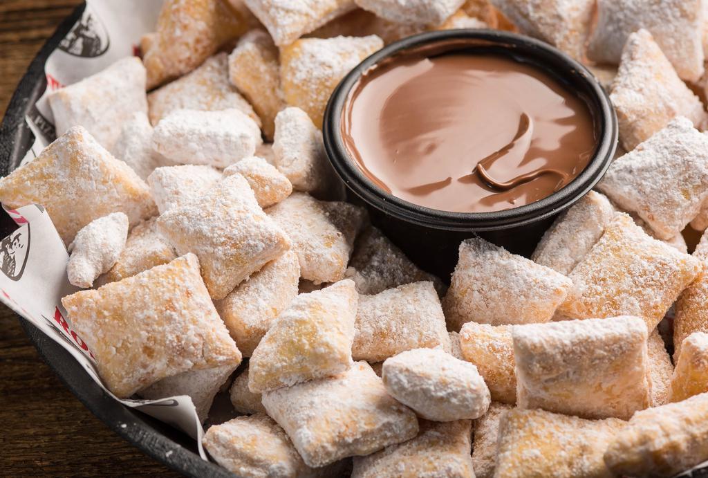Zeppole · Bite-sized pieces of crispy dough tossed in powdered sugar & paired with rich Nutella hazelnut spread. 2810 cal. Serves 3-4.