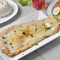 Bistec De Res Milanesa · Breaded Steak Topped with Ham and Cheese.