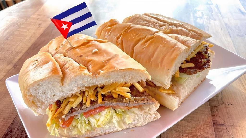 Pan Con Bistec W/ Fries · Steak sandwich, grilled onions, tomatoes, potatoes sticks, cuban bread