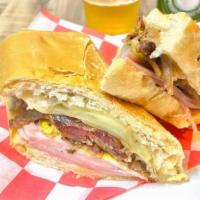 Sandwich Cubano W/ Fries · Ham, pork, swiss cheese, pickles, mustard, cuban bread