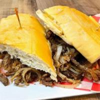 Pan Con Lechon W/ Fries · Grilled pork, sauteed onions, cuban bread