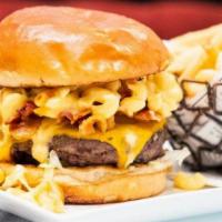 Sugar Factory Burger · Toasted buttered bun pickles, shredded lettuce, sliced tomato, crispy onions and sugar facto...