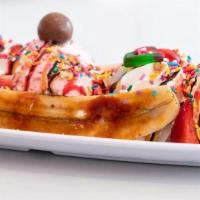 Banana Split · Strawberry and chocolate fudge drizzled cup filled with strawberries and sliced bananas, top...