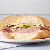 Italian Sub · A hoagie bun with salami, ham and provolone topped with a mix of romaine, sliced pepperoncin...