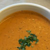 Tomato Basil Bisque · Vegetarian and gluten-free. Made with Italian plum tomatoes and basil in a cream-based broth.