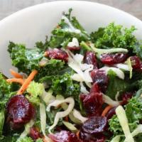 Kale Salad · Raw kale, cabbage, pumpkin seeds, carrots, Craisins and red onion tossed in a lemon yogurt d...