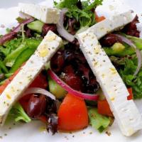 Greek · Mixed greens, tomato, cucumber, green peppers, capers, olives, onions, Greek feta cheese and...