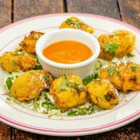 Chile Poppers · Anaheim chile, cheese, chipotle peppers, served with salsa ranchera