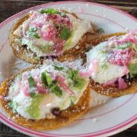 Fried Egg Tacos · Three tacos with fried eggs, black beans, habanero pickled onions, cotija cheese, avocado sa...