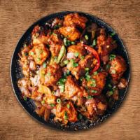 Chili Chicken · Stir fried Chicken with peppers, sauces, chilis, chopped onions and a special Indo-Chinese C...