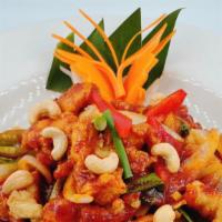 Cashew Nut  · Sautéed onions, green onion, bell peppers in a roasted chili sauce topped with cashew nuts.