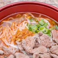 Pho Naue “Pho Beef Noodle Soup” · Boiled, sliced Flank steak, rice noodles, and bean sprouts in a spicy beef broth soup topped...
