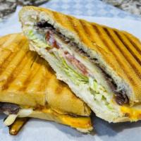 Pan Con Bistec · Steak, lettuce, tomato, papitas on Cuban bread