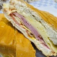Ham And Cheese Sandwich · Ham, swiss cheese, mayonnaise, butter, mustard, pickles, lettuse, tomato on cuban bread